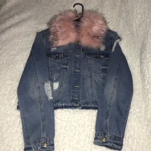 Distressed denim jacket with faux fur collar